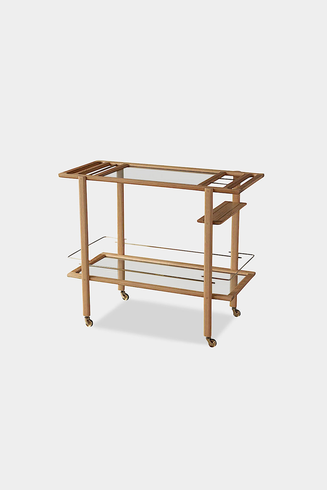 The BAR Cart from Earl Home is a solid wood bar cart on wheels with exquisite hand-cut joinery, featuring two shelves: a robust wood top and an elegant lower shelf made of tempered glass panels.