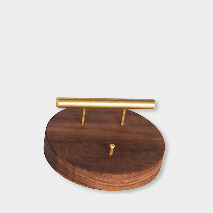 The BUSINESS Card Holder, expertly crafted by Earl Home from wood and brass, showcases a card with "CHRIS EARL." This elegant accessory can be customized to perfectly fit any desk or office setting.