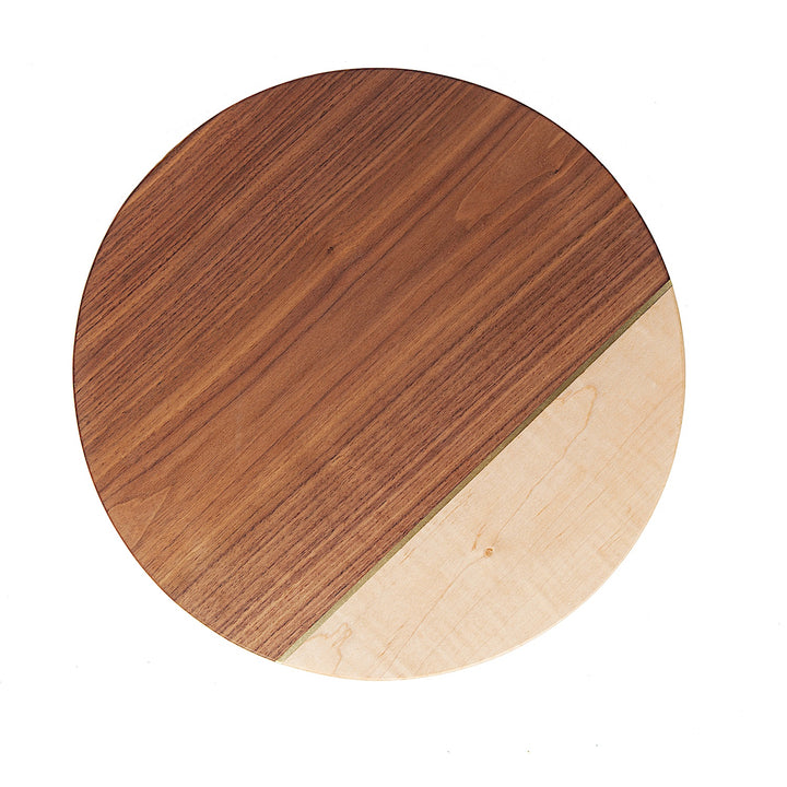 The CIRCLE Cheese Board by Earl Home is a stylish essential for entertaining, doubling as a handcrafted cheeseboard with its two-tone design featuring a diagonal divide of dark walnut and light maple. Ideal for elevating your presentations.