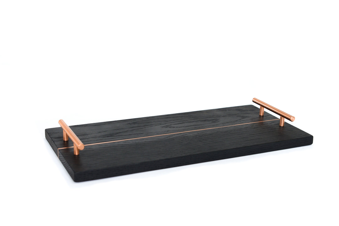 The RECTANGLE Service Tray by Earl Home is a handcrafted, two-tone wooden serving board with elegant brass handles, featuring a light and dark wood design akin to a classic brass tray.