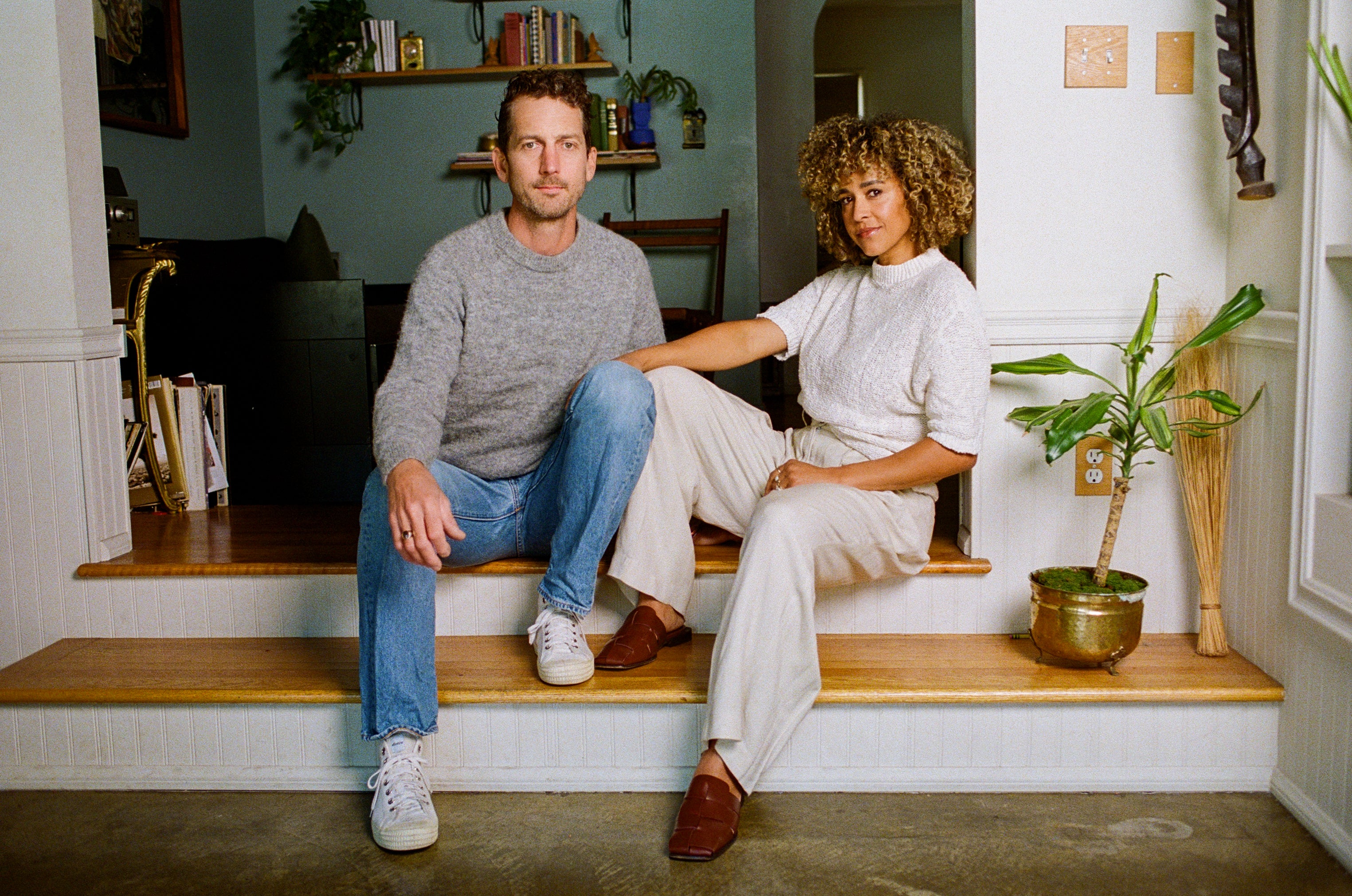 Chris and Amber Earl of Earl Home sitting in their living room in Los Angeles, California.