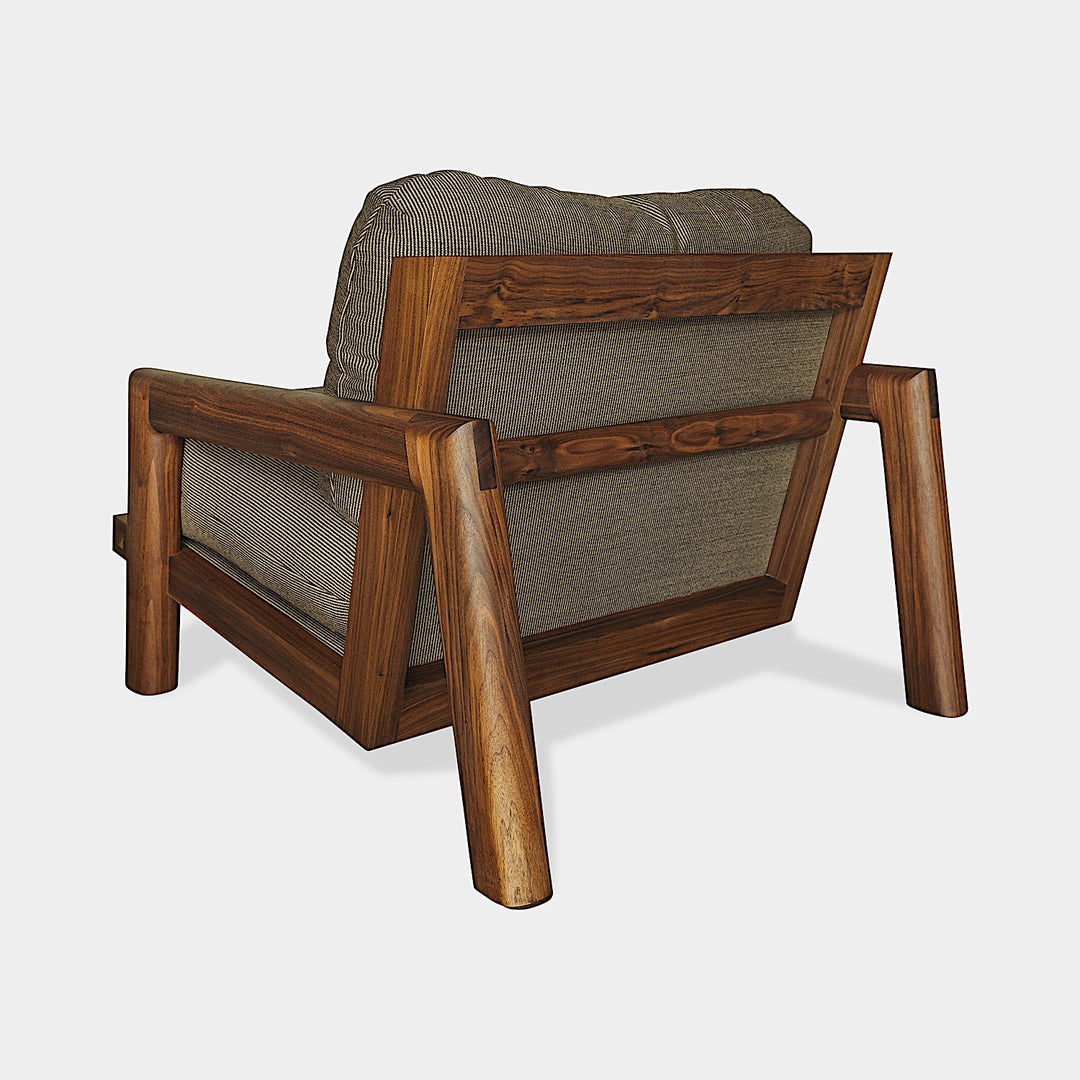 The Earl Home Walnut TAMBU Lounge Chair boasts kvdrat fuse striped fabric upholstery, a sturdy walnut frame, and plush down cushioned seat and backrest gives the ultimate cozy hygge vibe.