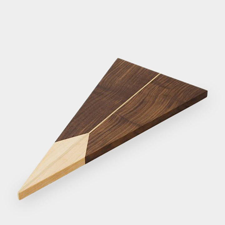 The TRIANGLE Cheese Board by Earl Home is a stylish centerpiece with a triangular design, lighter wood apex, darker base, brass and wood accents, and a central vertical division.