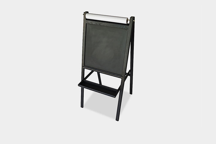 The KIDS Easel by Earl Home is a freestanding kids' easel made from sustainably sourced hardwood, featuring a chalkboard surface and a paper roll at the top.