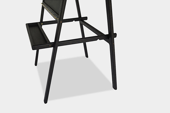 The KIDS Easel by Earl Home is a freestanding kids' easel made from sustainably sourced hardwood, featuring a chalkboard surface and a paper roll at the top.