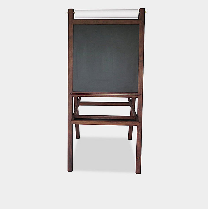 The KIDS Easel by Earl Home is a freestanding kids' easel made from sustainably sourced hardwood, featuring a chalkboard surface and a paper roll at the top.