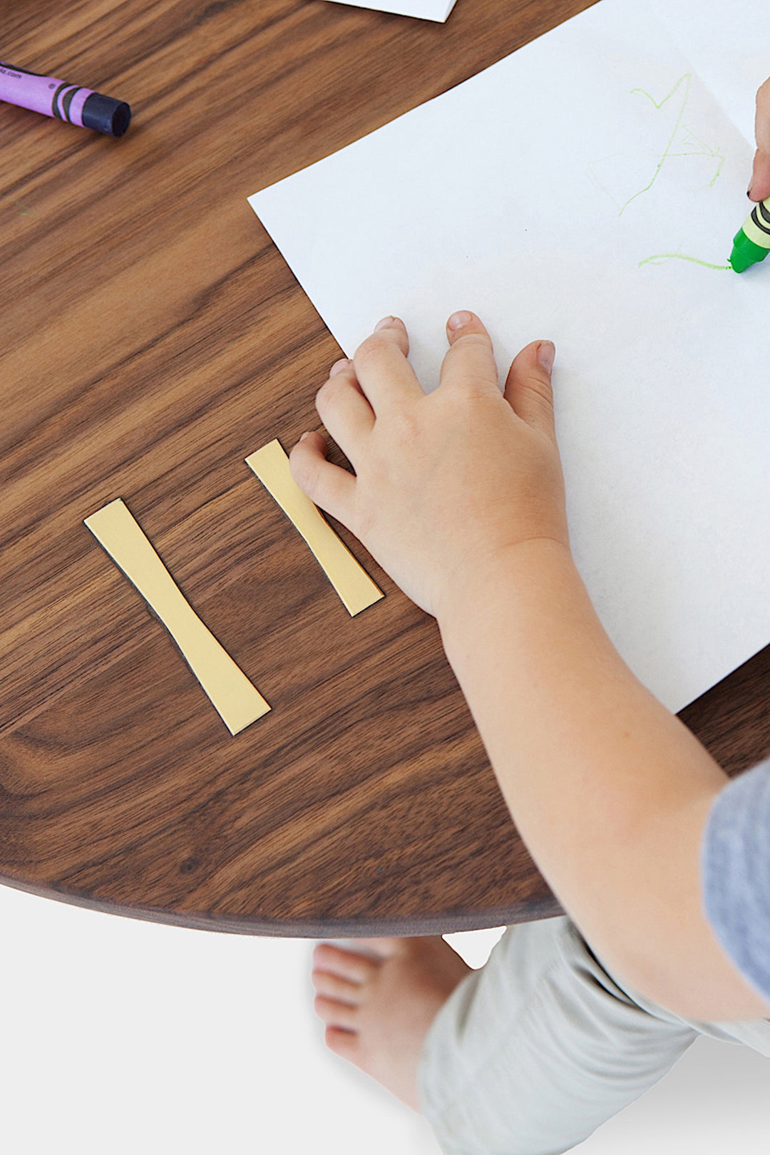 A top view showcases the Earl Home KIDS Set, featuring a custom, round wooden table made from sustainably sourced American hardwood. Two rectangular chairs are ideally positioned on opposite sides for a kid's table setup.