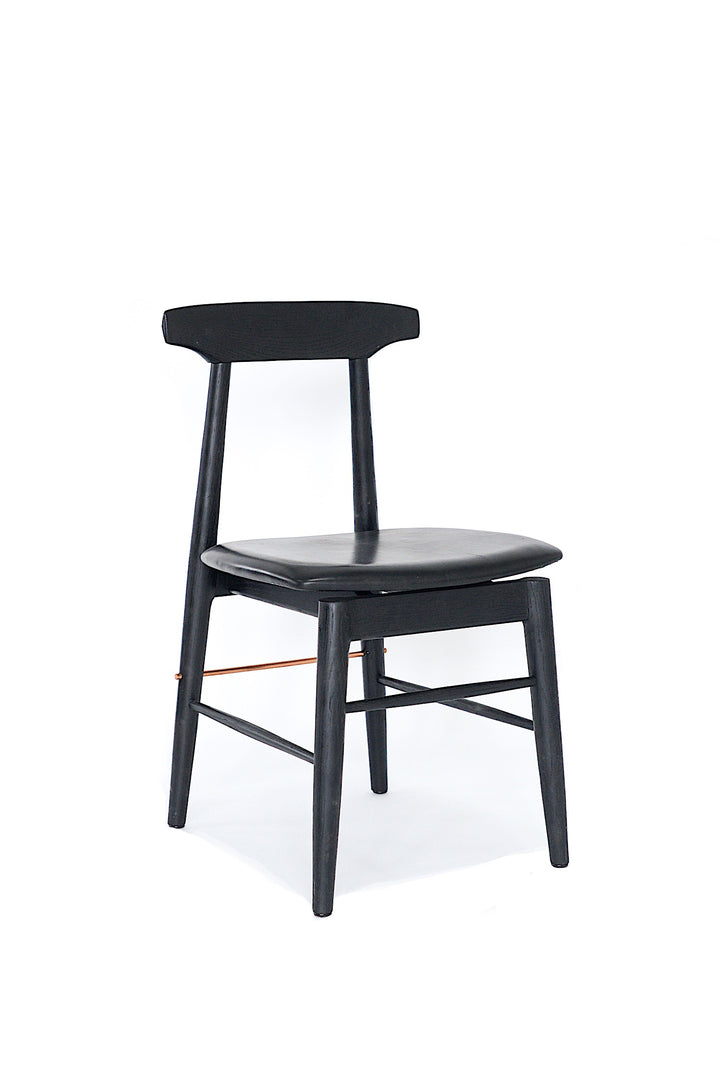 The Earl Home SABLE Dining Chair features a hand-made, black wooden design with a curved backrest and four legs. Its flat seat exemplifies minimalist elegance, crafted from solid wood for lasting durability.