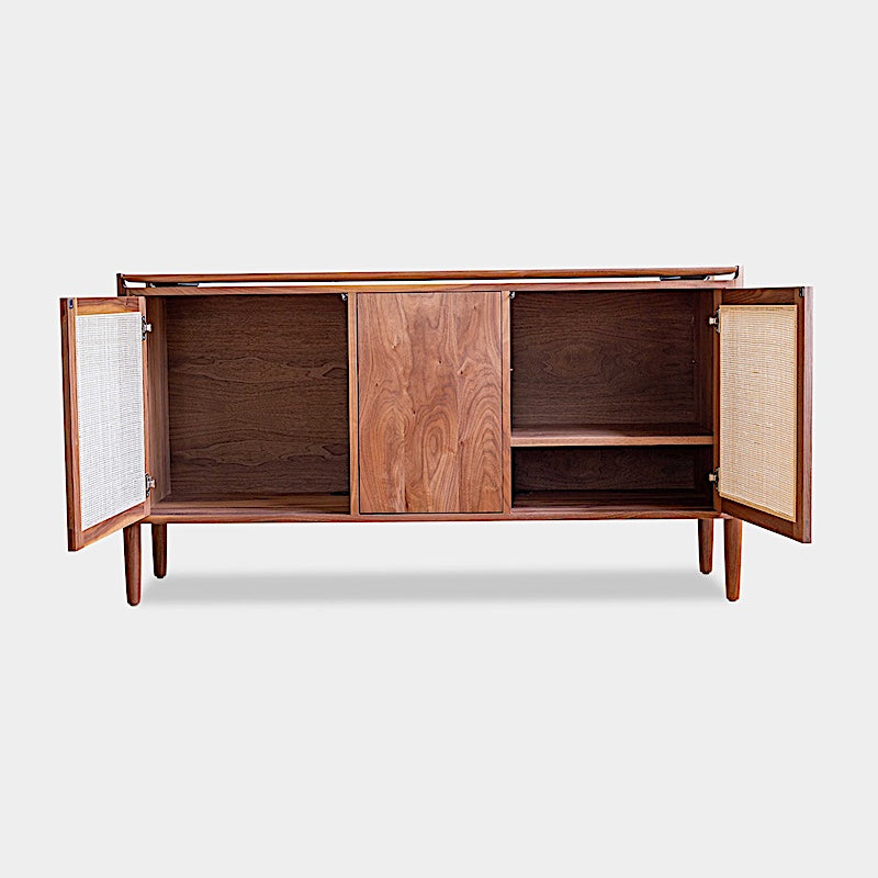 The KABOT Sideboard (Low) by Earl Home is a wooden mid-century modern dresser, featuring two woven panels and slender legs, exemplifying heritage quality design.