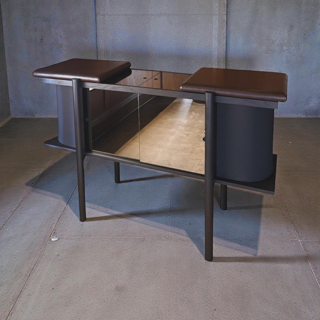 Modern Record Cabinet in a dark solid wood with dark brown leather wrapped  top in a minimalistic room.