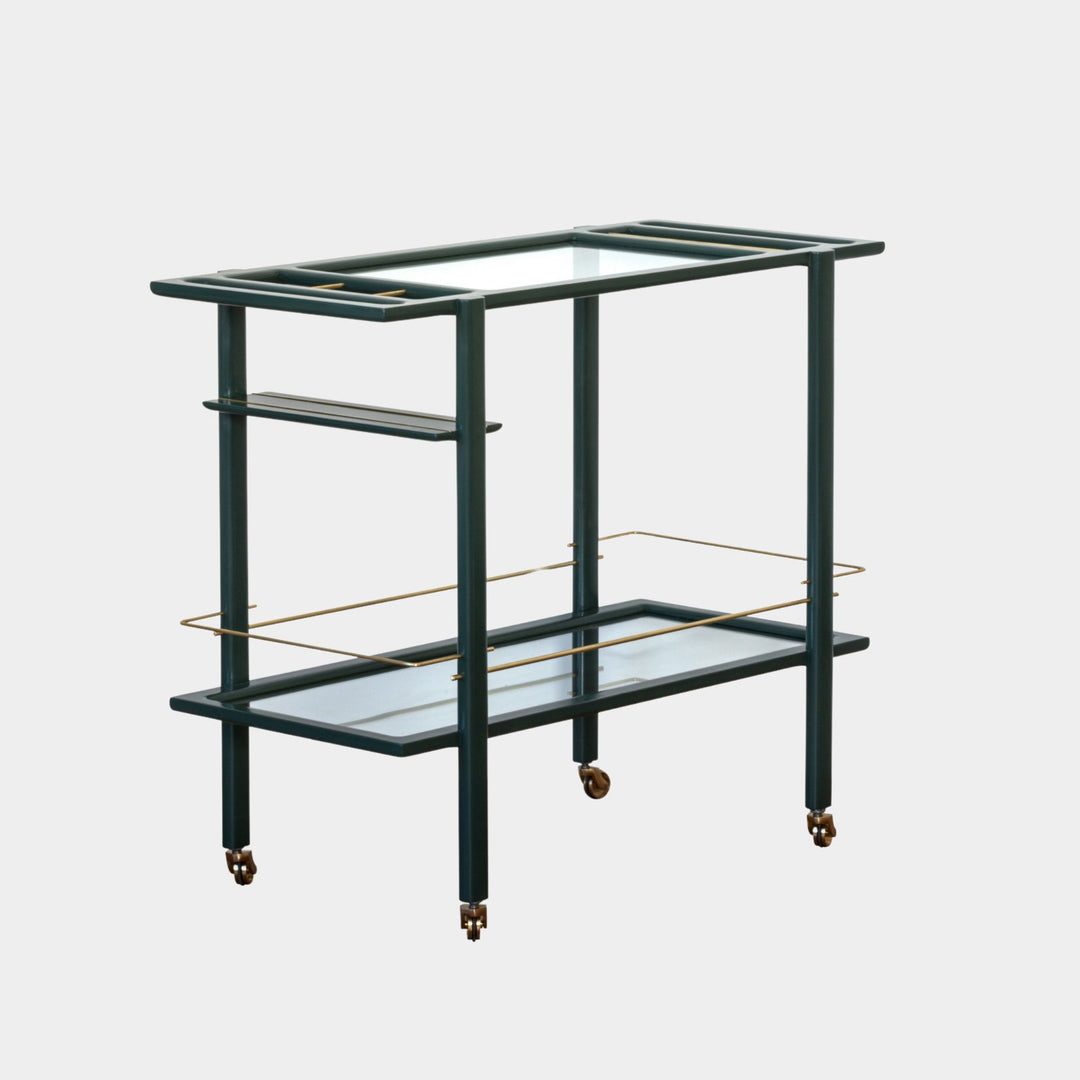 This bespoke BAR Cart from Earl Home is a custom hand made solid wood bar cart on wheels with exquisite hand-cut joinery, featuring two shelves: a robust tempered glass top and an elegant lower shelf made of clear or smoked tempered glass. This cart comes in walnut, white oak, ebonized oak, or lacquered in any pantone color. Brass, Copper and Aluminum are the metal types offered for detail.