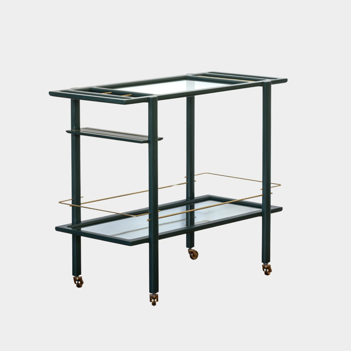 This bespoke BAR Cart from Earl Home is a custom hand made solid wood bar cart on wheels with exquisite hand-cut joinery, featuring two shelves: a robust tempered glass top and an elegant lower shelf made of clear or smoked tempered glass. This cart comes in walnut, white oak, ebonized oak, or lacquered in any pantone color. Brass, Copper and Aluminum are the metal types offered for detail.