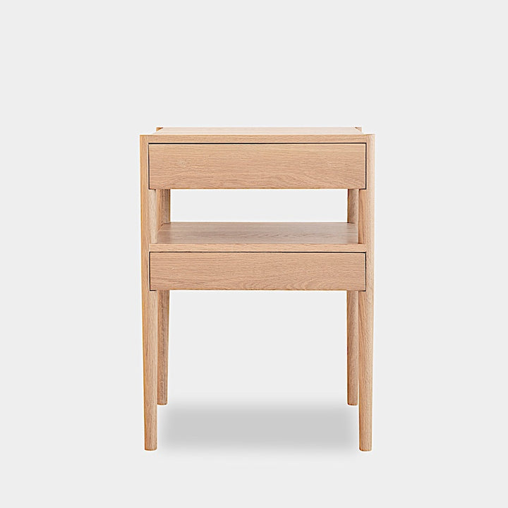 The Earl Home BEDSIDE Table is a solid wood nightstand featuring two open drawers, a minimalist design, and a natural finish. Custom sizing ensures it fits your space perfectly.