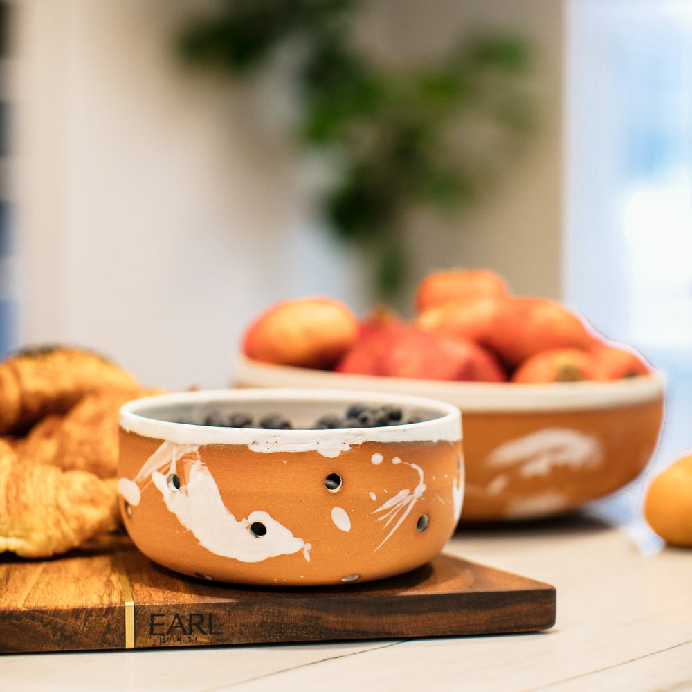 Berry Colander Hand made pottery, hand thrown ceramic mesh bowl with terra cotta clay and cream splattered glaze, made in Los Angeles, California. Great for rinsing berries, or fruit. Microwave and dishwasher safe.
