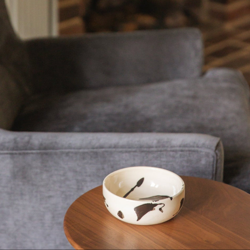 small handmade ceramic nesting bowl with black splattered detail. Perfect to hold nuts, salsa, fruit, or cereal.