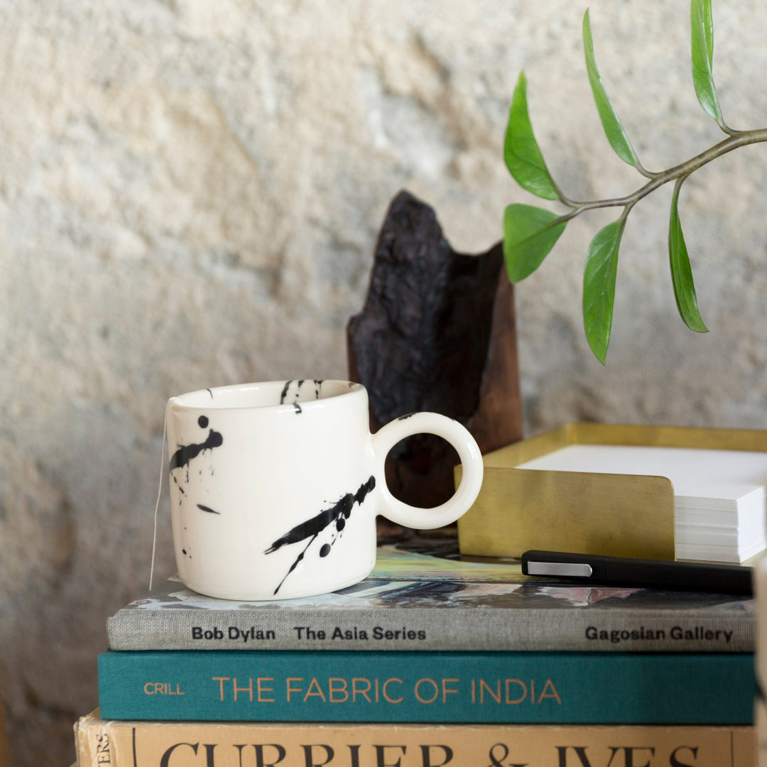 EARL Ceramic hand thrown circle mug, with black splattered glaze.