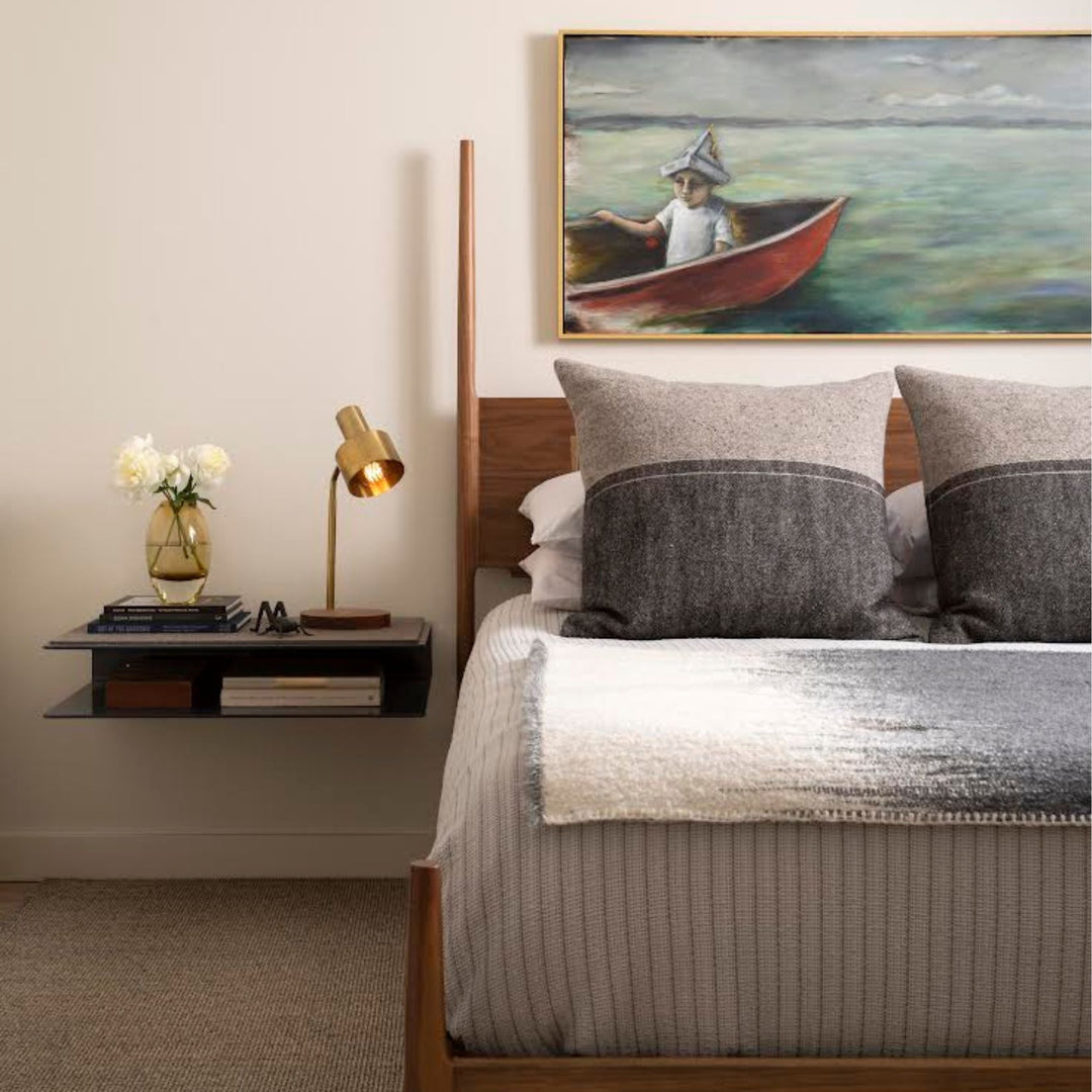 The DANSK Bed by Earl Home features a solid wood frame with a tall headboard and luxurious bedding, creating your perfect sanctuary. Originally crafted in Los Angeles, California in walnut with maple spliced posts it exemplifies quality and is handmade to order. It is available in White oak, ebonized oak or ash. The dutchman joint can be hand cut in tonal wood, brass, copper, or aluminum.