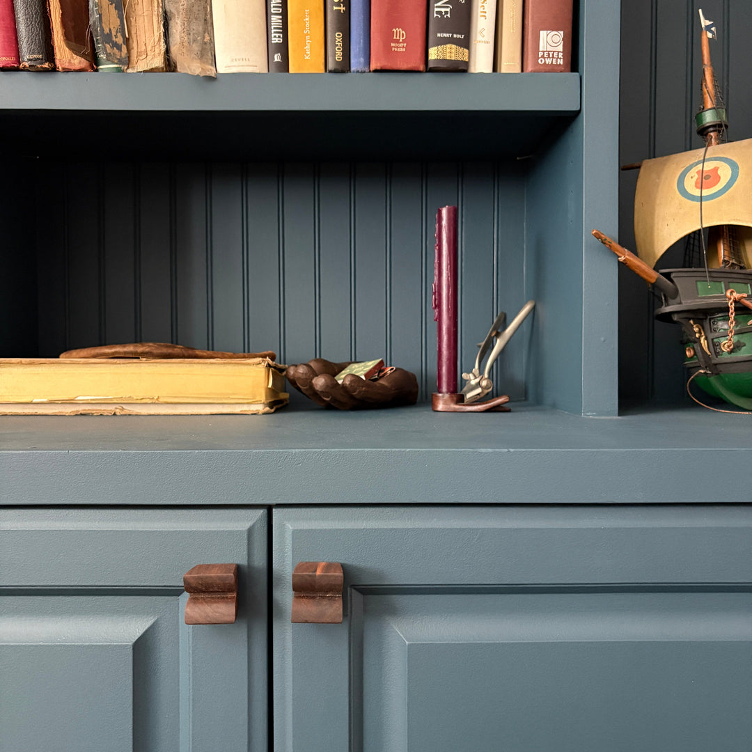 Custom bespoke cabinet knobs, made of solid wood and available in walnut, white oak or ebonized oak.