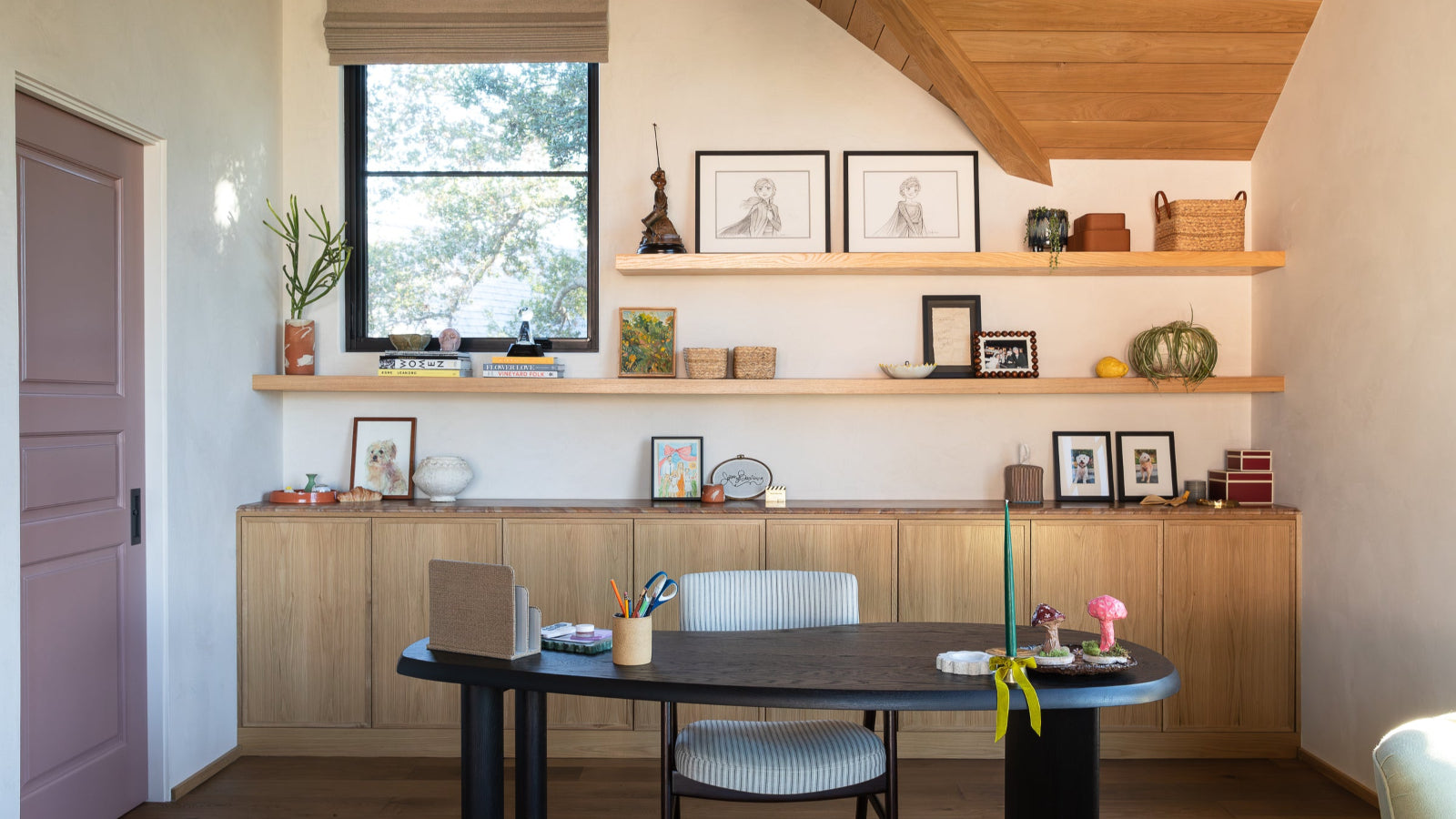 Kristen Bell office design by EARL Home. Custom white oak cabinet built-in with floating shelves.