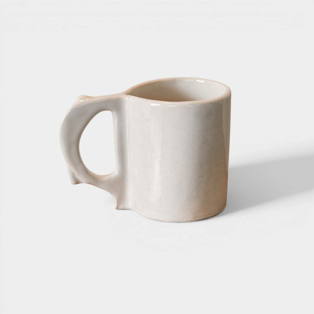 Hand sculpted Ceramic mug with ivory glossy glaze finish. Slab rolled hand built in Los Angeles, California. Made in America.