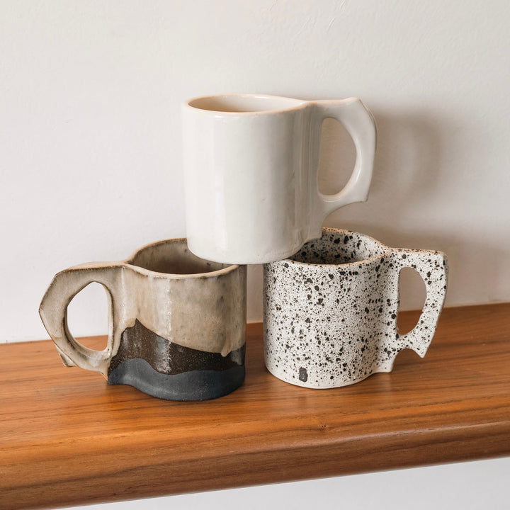 Hand sculpted Ceramic mugs in speckle or two-tone design. Slab rolled hand built in Los Angeles, California. Made in America.