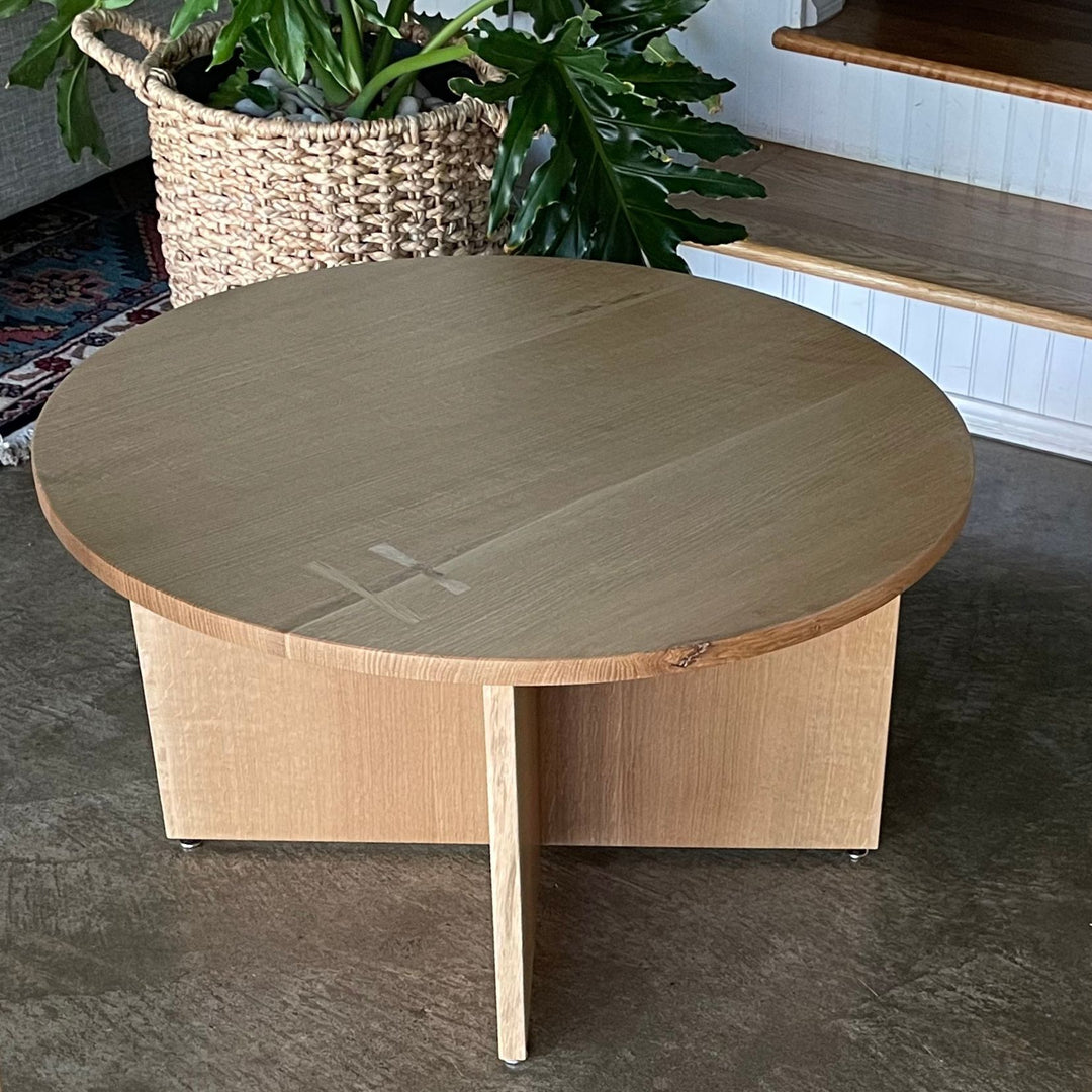 The Earl Home KIDS Set, featuring a custom, round wooden table made from sustainably sourced American hardwood. Two rectangular chairs are ideally positioned on opposite sides for a kid's table setup. Walnut mixed with maple, solid walnut, solid white oak, ebonized oak are all options for this custom made to order set.