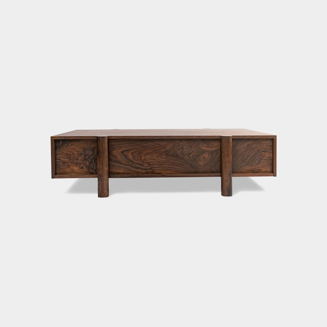 This LAPILO Coffee Table from Earl Home Designed by Chris Earl is solid wood constructed with hand cut joinery. With drawers on both the front and back, it’s not only visually appealing but also incredibly practical, making it an ideal choice for a game table or a multi-functional living room space. This table comes in walnut, maple, white oak, ebonized oak and is custom made in any size or shape desired.