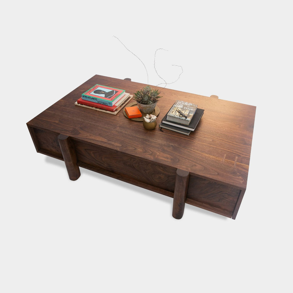 This LAPILO Coffee Table from Earl Home Designed by Chris Earl is solid wood constructed with hand cut joinery. With drawers on both the front and back, it’s not only visually appealing but also incredibly practical, making it an ideal choice for a game table or a multi-functional living room space. This table comes in walnut, maple, white oak, ebonized oak and is custom made in any size or shape desired.