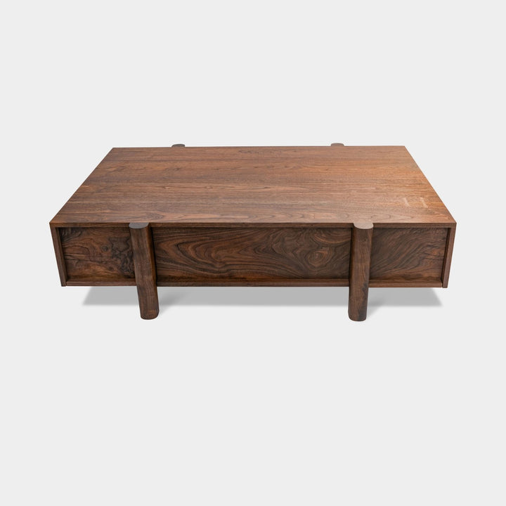 This LAPILO Coffee Table from Earl Home Designed by Chris Earl is solid wood constructed with hand cut joinery. With drawers on both the front and back, it’s not only visually appealing but also incredibly practical, making it an ideal choice for a game table or a multi-functional living room space. This table comes in walnut, maple, white oak, ebonized oak and is custom made in any size or shape desired.