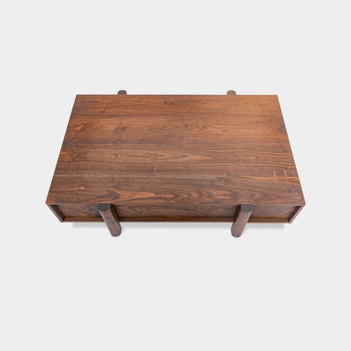 This LAPILO Coffee Table from Earl Home Designed by Chris Earl is solid wood constructed with hand cut joinery. With drawers on both the front and back, it’s not only visually appealing but also incredibly practical, making it an ideal choice for a game table or a multi-functional living room space. This table comes in walnut, maple, white oak, ebonized oak and is custom made in any size or shape desired.