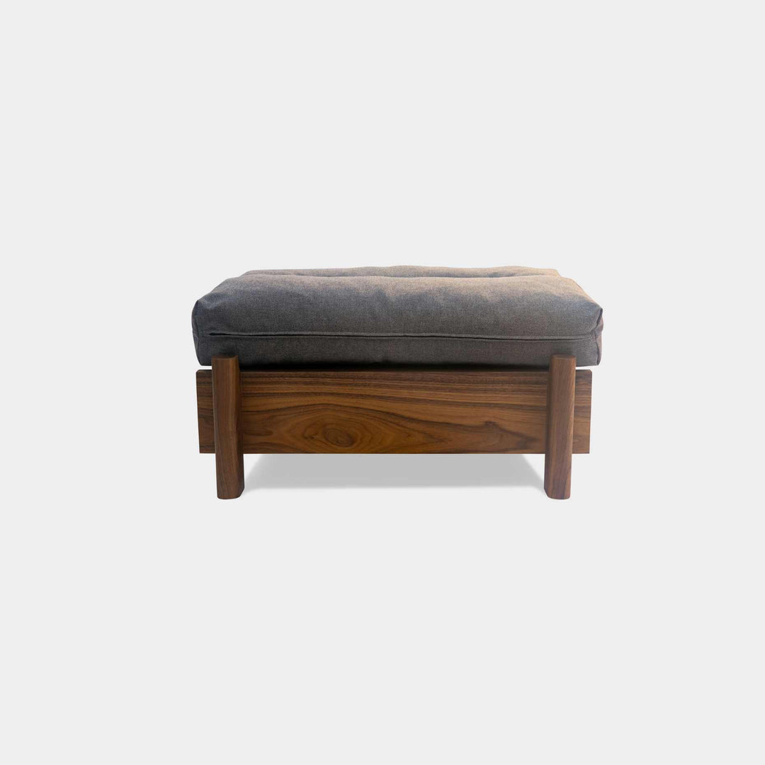 This EARL handmade dog bed has a solid wood base with a hidden drawer, and a custom detachable cushion upholstered in Sunbrella Blend Coal. We offer various fabrics and customers own fabric is encouraged as well. The base can be made in walnut, white oak, or ebonized oak and custom sizing is also available.