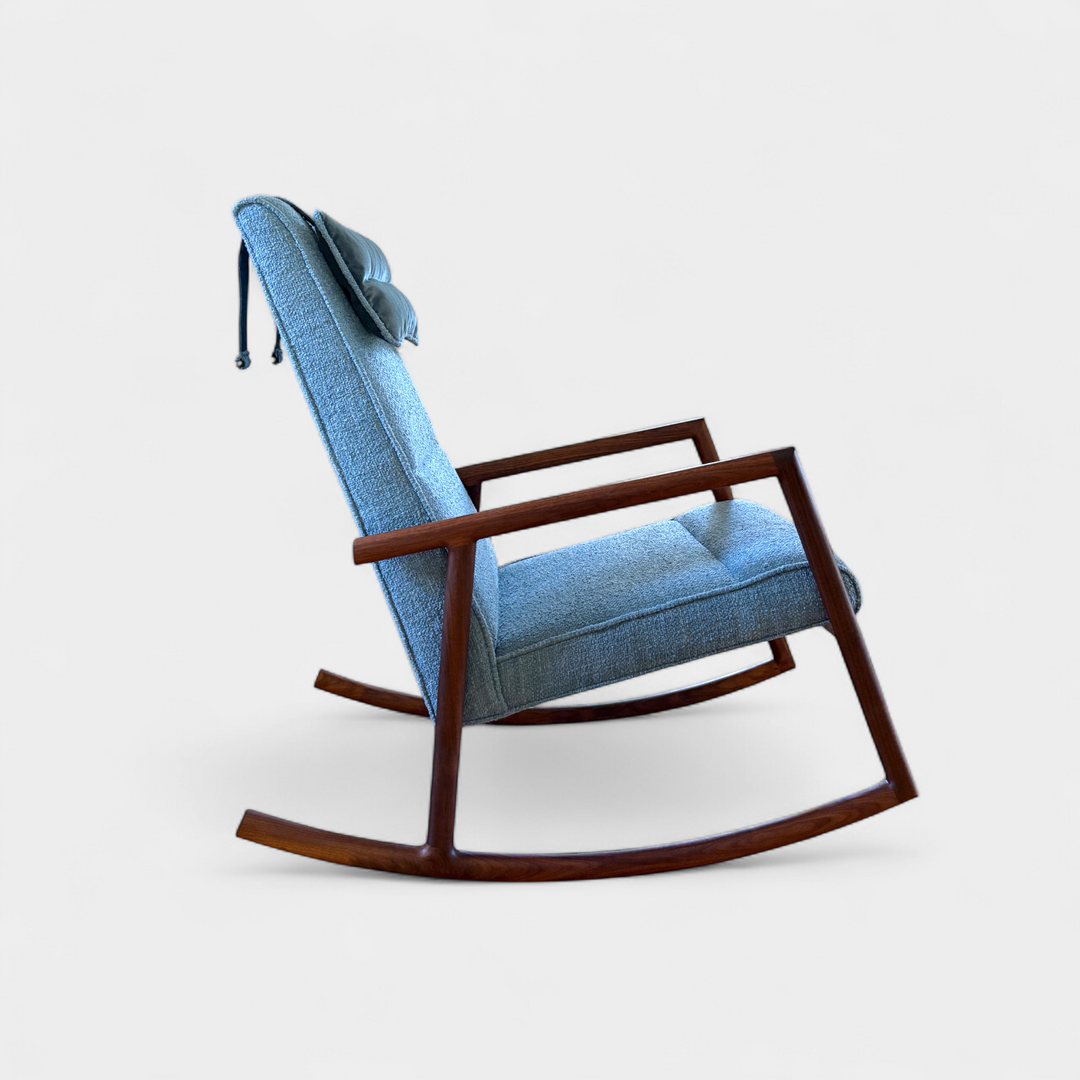 Solid wood constructed rocking chair with hand-cut joinery and custom upholstered seat. Walnut, Oak, custom and handmade.
Perfect in a modern living room with a colorful abstract painting on the wall, wooden floor, and furniture.