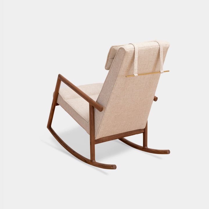 Rear view of the MORESBY Rocker by Earl Home. This handmade wooden rocking chair features walnut solid wood construction, ivory linen cushions, a custom upholstered seat, and an attached headrest.