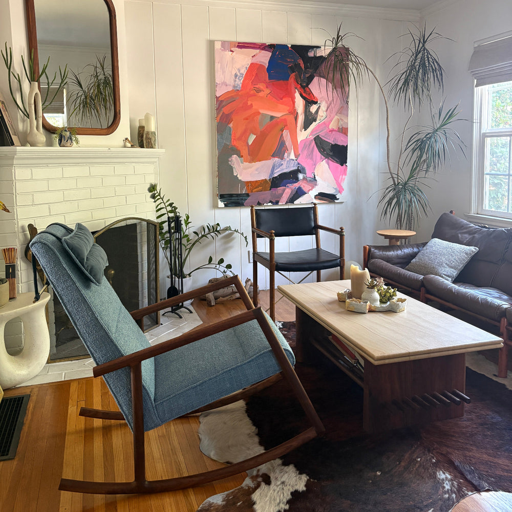 Solid wood constructed rocking chair with hand-cut joinery and custom upholstered seat. Walnut, Oak, custom and handmade.
Perfect in a modern living room with a colorful abstract painting on the wall, wooden floor, and furniture.