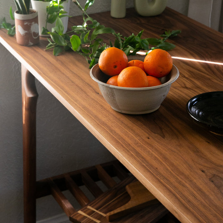 Solid Walnut wooden bread board or kitchen island with a slatted shelf for all of your cook books or produce baskets. 