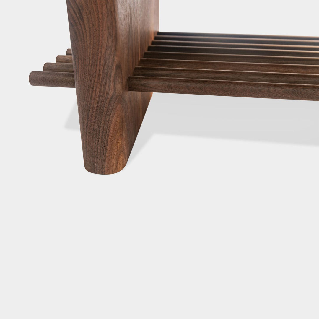 The sandstone top coffee table, featuring a refined double bullnose edge, showcases the stone’s natural beauty while adding a soft, sculpted touch. 
Supporting this stunning top is a sleek and sophisticated solid walnut base, meticulously crafted for both durability and style. 