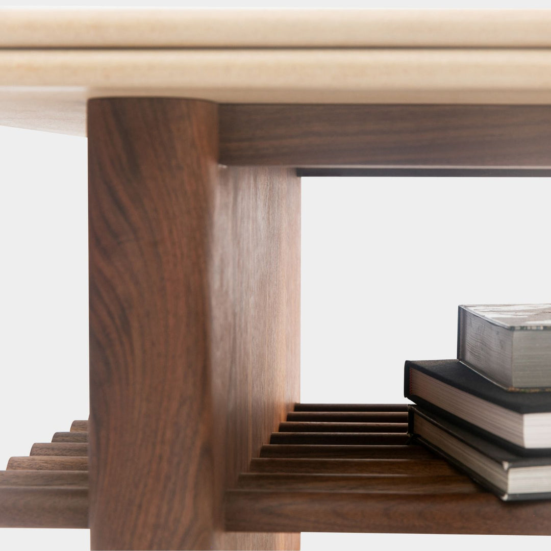 The sandstone top coffee table, featuring a refined double bullnose edge, showcases the stone’s natural beauty while adding a soft, sculpted touch. 
Supporting this stunning top is a sleek and sophisticated solid walnut base, meticulously crafted for both durability and style. 