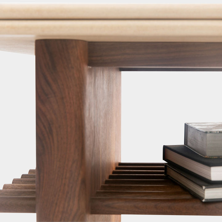 The sandstone top coffee table, featuring a refined double bullnose edge, showcases the stone’s natural beauty while adding a soft, sculpted touch. 
Supporting this stunning top is a sleek and sophisticated solid walnut base, meticulously crafted for both durability and style. 