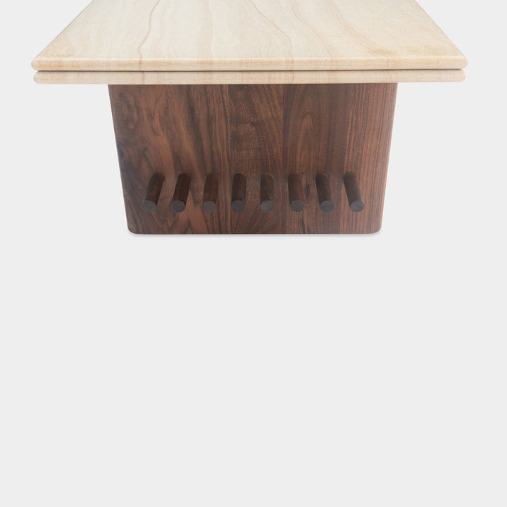 The sandstone top coffee table, featuring a refined double bullnose edge, showcases the stone’s natural beauty while adding a soft, sculpted touch. 
Supporting this stunning top is a sleek and sophisticated solid walnut base, meticulously crafted for both durability and style. 