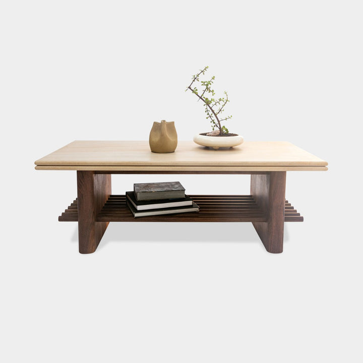 The sandstone top coffee table, featuring a refined double bullnose edge, showcases the stone’s natural beauty while adding a soft, sculpted touch. 
Supporting this stunning top is a sleek and sophisticated solid walnut base, meticulously crafted for both durability and style. 