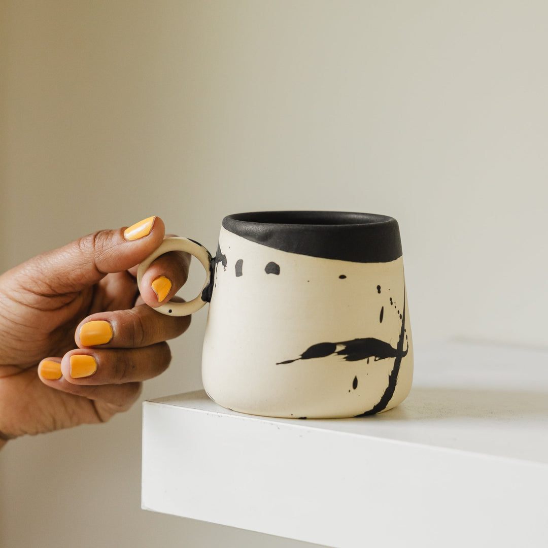 EARL hand thrown black splattered mug
