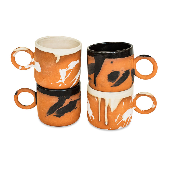 Set of four ceramic mugs with artistic designs Hand made pottery, hand thrown ceramic cup with terra cotta clay and cream splattered glaze, made in Los Angeles, California. Great for coffee, or tea. Microwave and dishwasher safe.