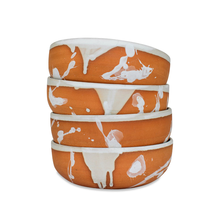 Set of 4 hand thrown ceramic bowls with white abstract splattered glaze.