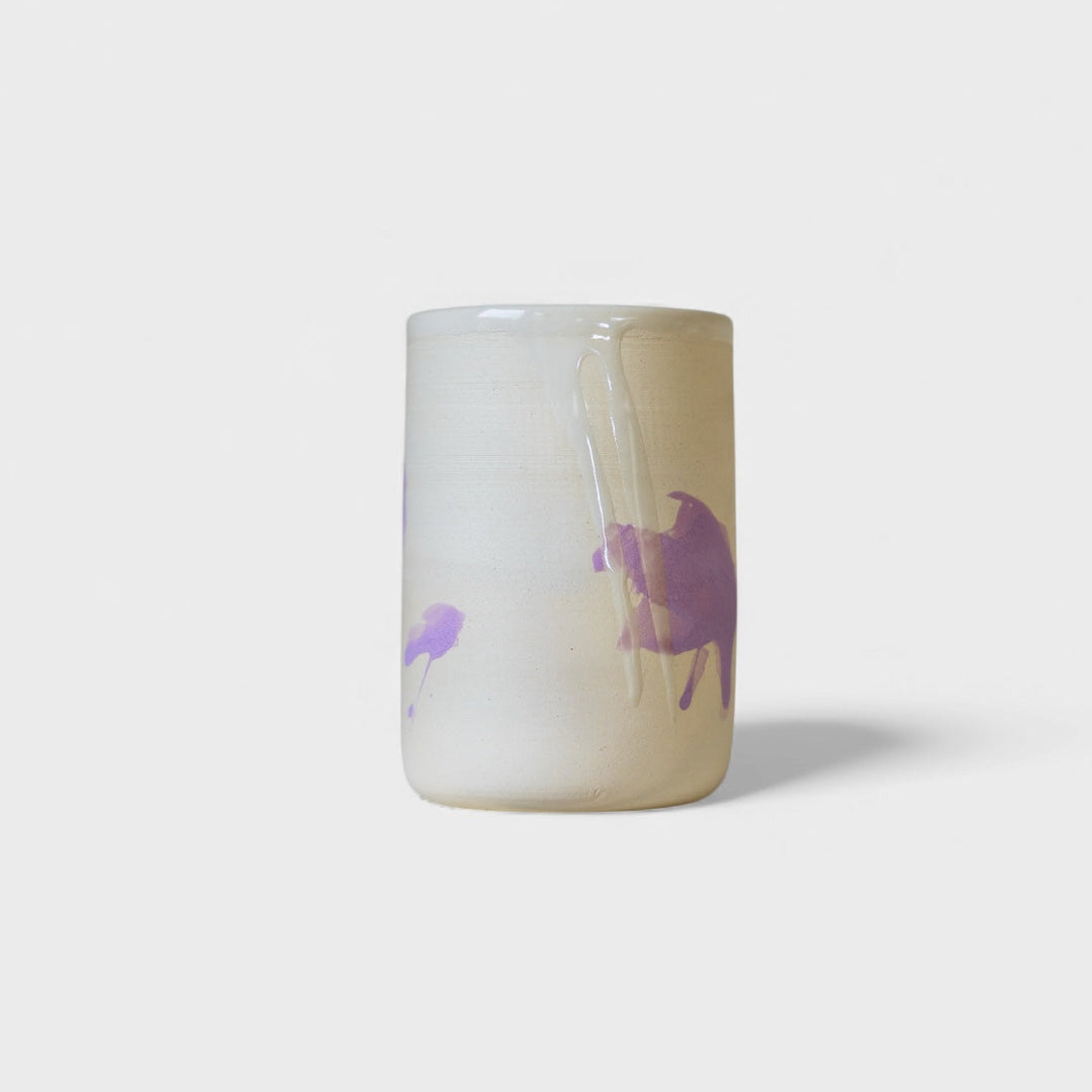 Four cylindrical cups with blue splatter abstract paint or glaze design. Hand thrown handmade pottery. Coffee Cup or mug perfect for cozy hygge morning. 