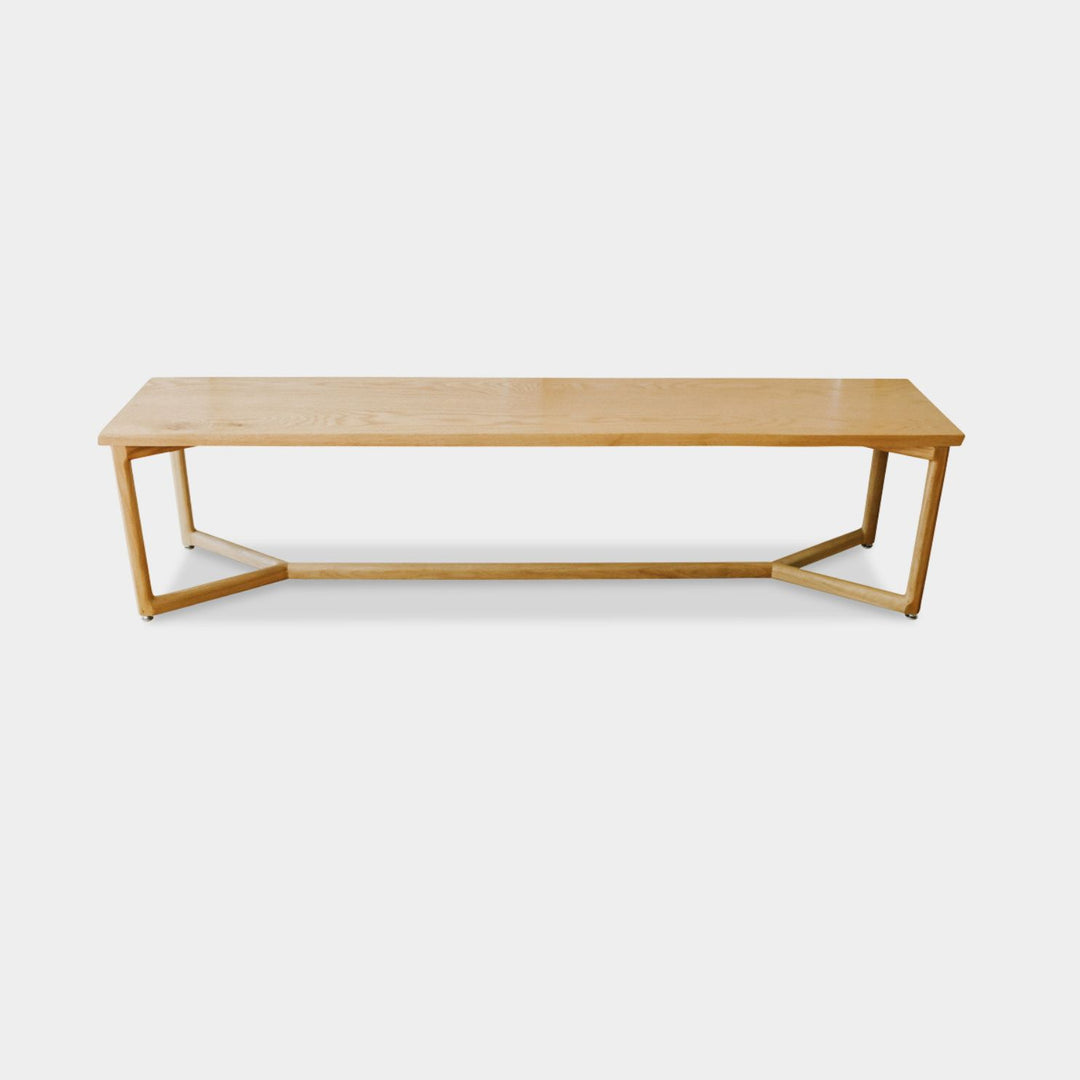 The WOLF Bench by Earl Home is a handcrafted piece with a natural finish and angular legs that highlight the beauty of solid wood top. Available in white oak, walnut or ebonized oak.