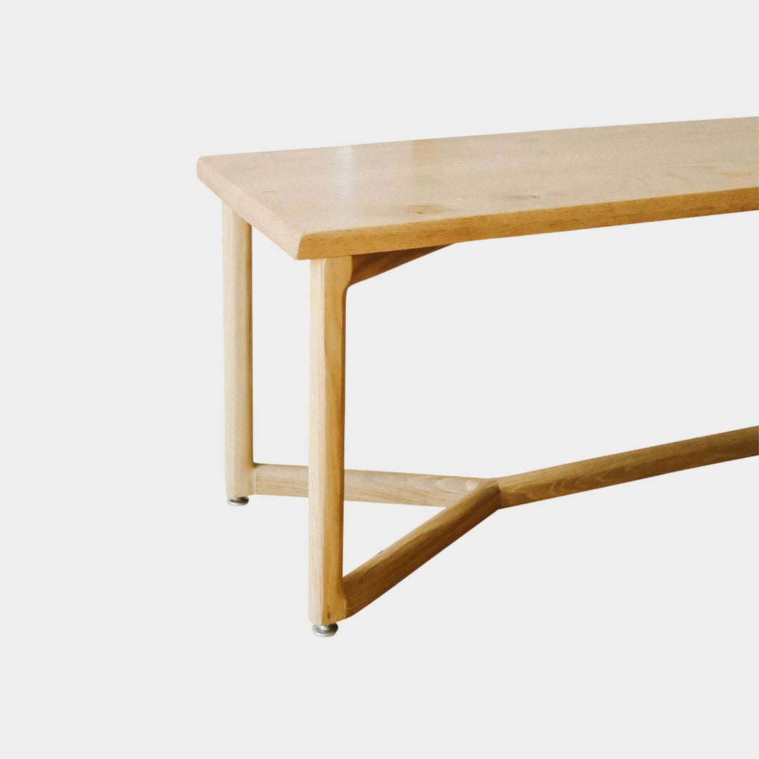 The WOLF Bench by Earl Home is a handcrafted piece with a natural finish and angular legs that highlight the beauty of solid wood top. Available in white oak, walnut or ebonized oak.