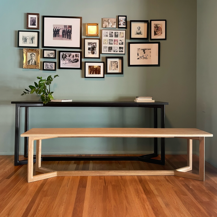 Black ebonized oak mid century modern console table with two lamps and interior designer decorative items. Perfect entry way table.
