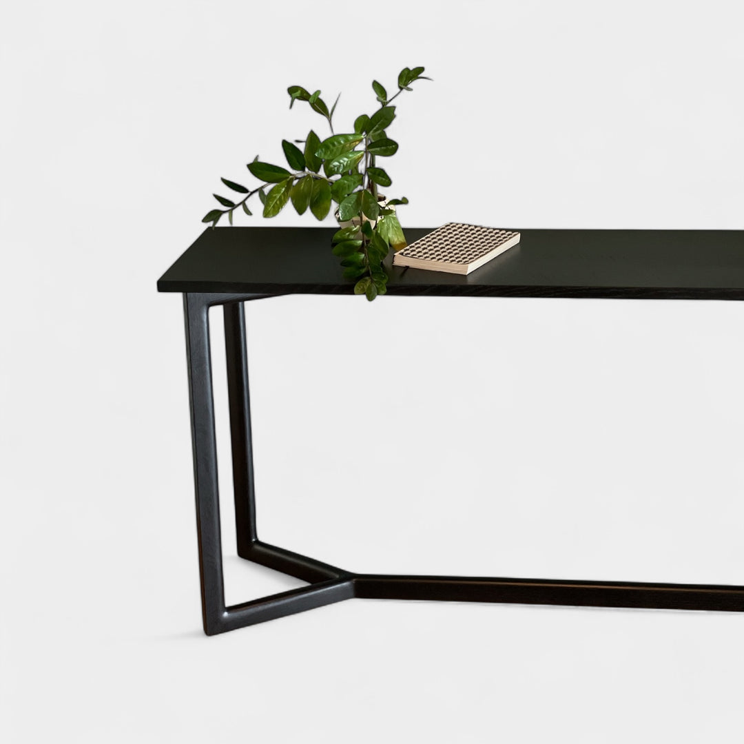 Black ebonized oak mid century modern console table with two lamps and interior designer decorative items. Perfect entry way table.