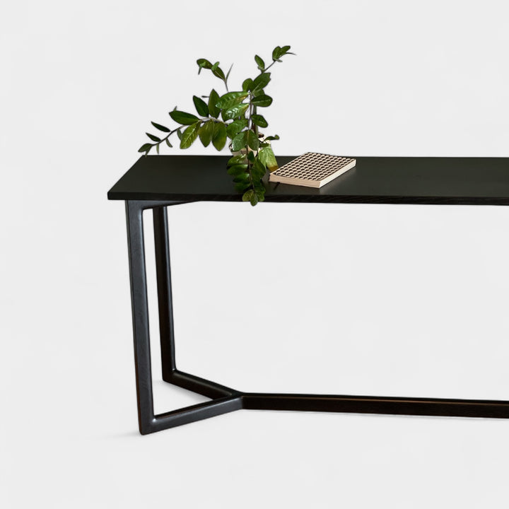 Black ebonized oak mid century modern console table with two lamps and interior designer decorative items. Perfect entry way table.