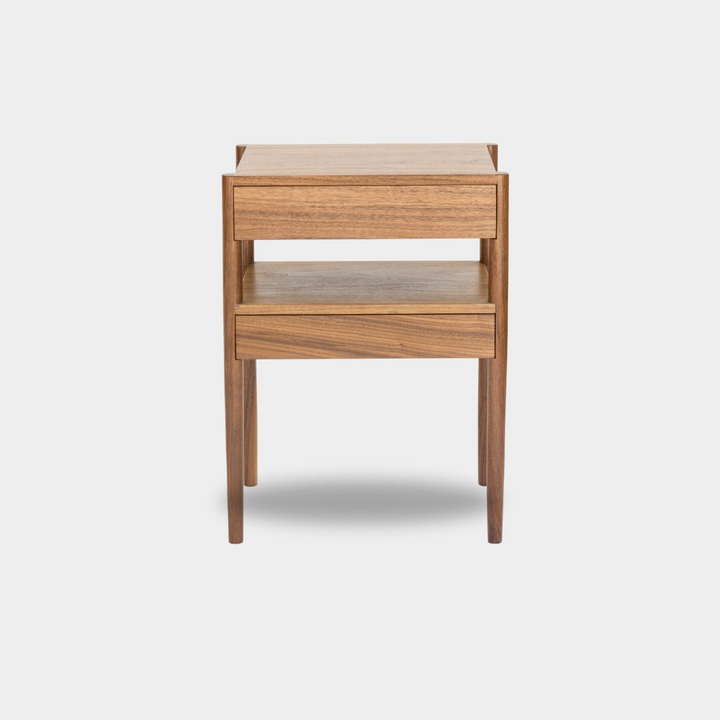 The Earl Home BEDSIDE Table is a solid wood nightstand featuring two open drawers, a minimalist design, and a natural finish. Custom sizing ensures it fits your space perfectly.